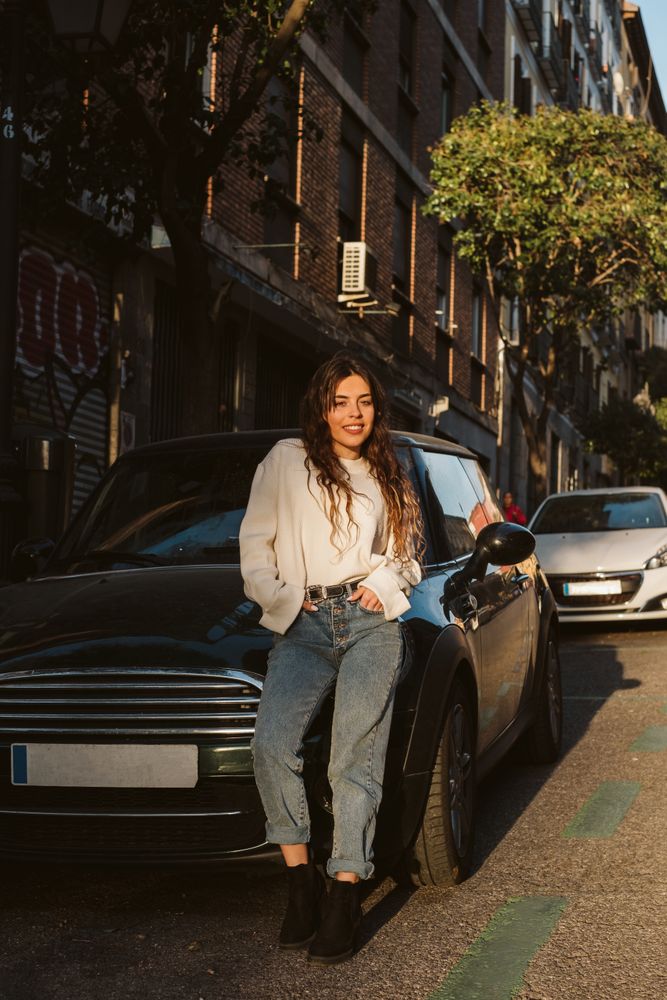 Cheerful young woman in street