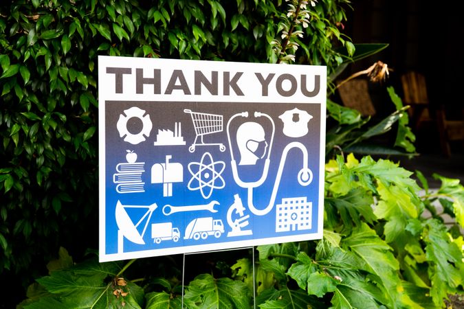 Angled view of yard sign showing gratitude to frontline workers
