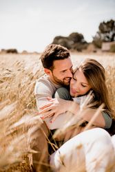 Serene lovers embracing on wheat field