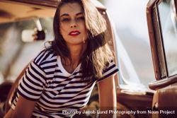 Woman looking at camera wearing striped shirt 0vneG0