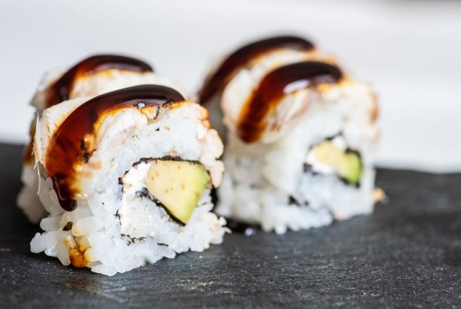 Japanese sushi rolls with crab, avocado, eel sauce and cream cheese