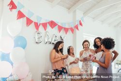 Pregnant woman celebrating baby shower with friends 5kRj73