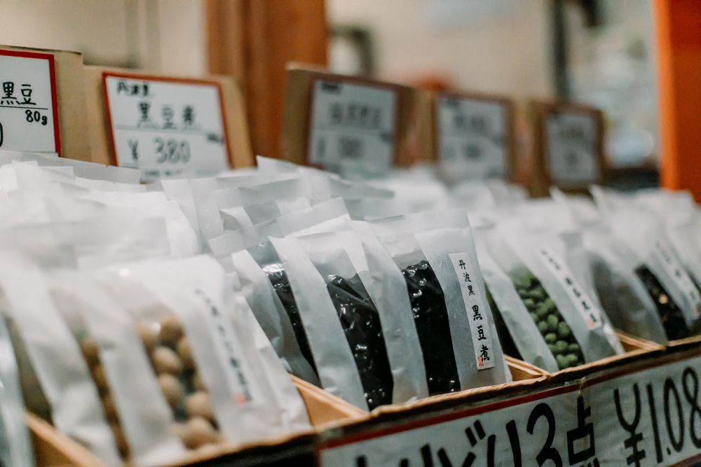 Packed beans with kanji text in a store