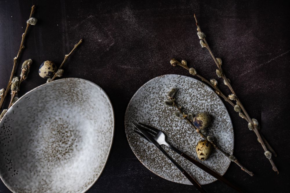 Easter table setting with two plates and quail eggs