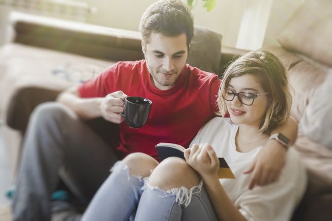 Couple sitting at couch together