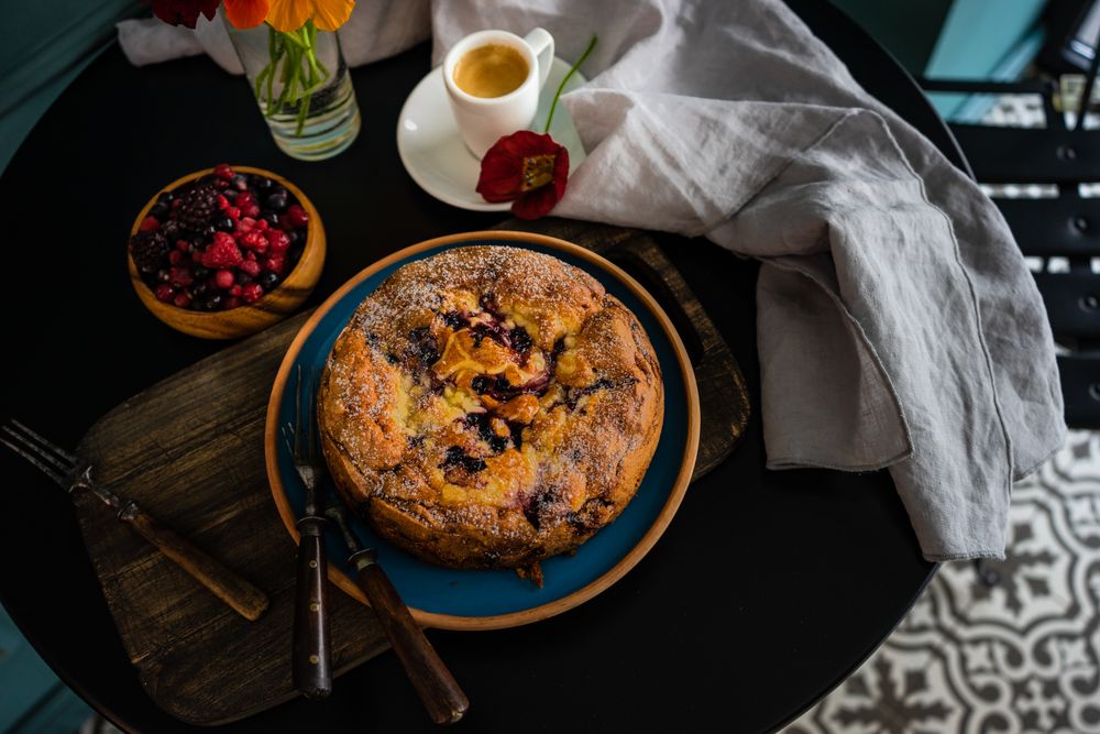 Top view of freshly baked fruit cake served with coffee