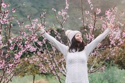 Happy woman in spring countryside