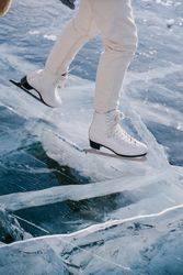 Woman skating on frozen river