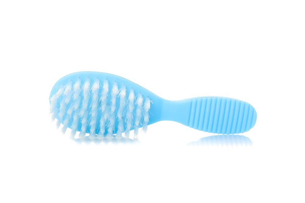 Baby brush isolated on blank background. Hygiene