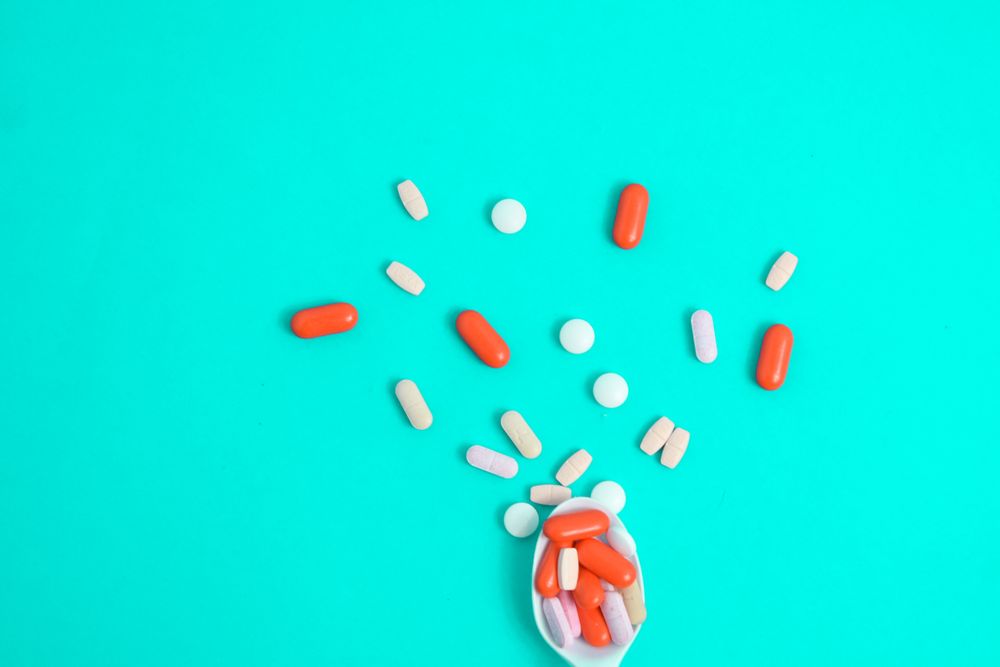 Spoon with a variety of colorful tablets
