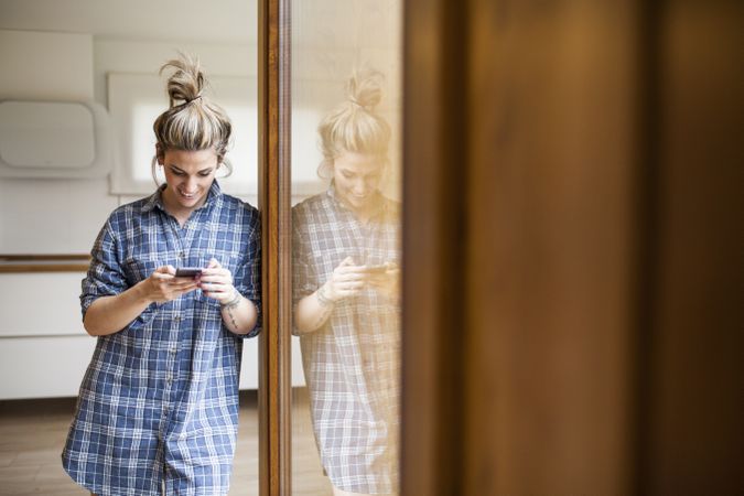 Woman at home on the mobile phone