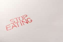 Simple red inscription calling to stop eating