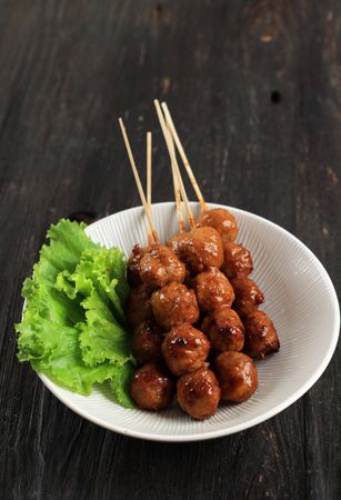 Bakso Bakar, Grilled Meatball with Soy and Chilli Sauce on Plate