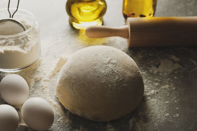 Concept for baking with dough on gray background