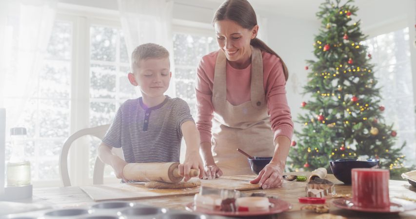 Portrait of Woman and her Son Baking Together During Christmas.