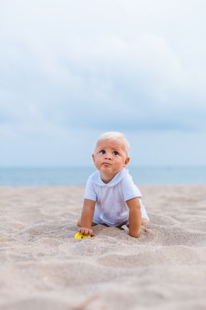 Blond baby on the beach