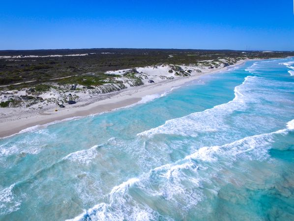 Aerial vie of ocean waves crashing on shore in Lancelin, Western Australia, Australia 