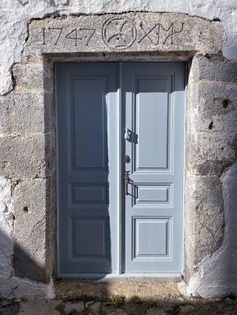 Patmian blue door with hand knocker