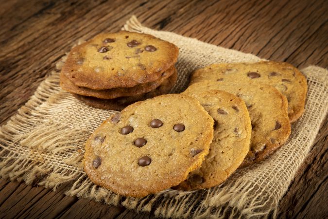 Delicious chocolate cookies on wooden table.
