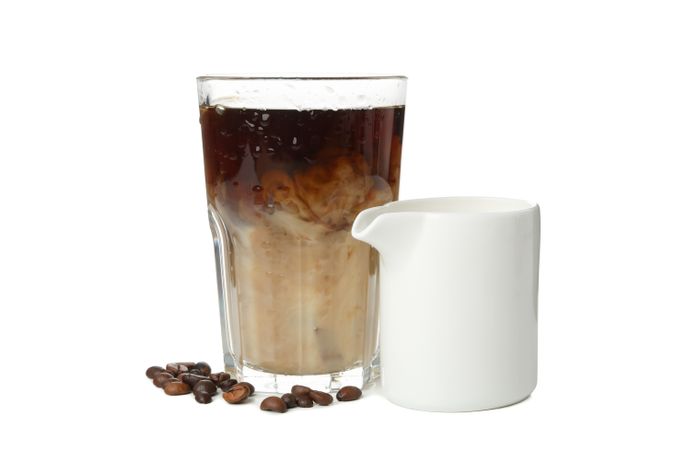 Glass of ice coffee isolated on plain background
