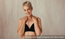 Portrait of a smiling mature woman posing in her natural body 5wavRb