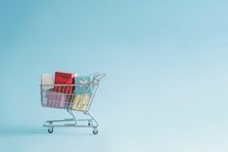 Shopping cart full with gift boxes