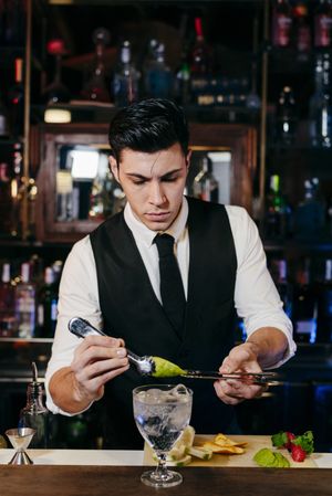 Barman working making drinks