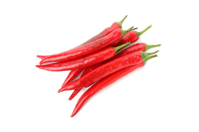Tasty red chilli peppers isolated on blank background