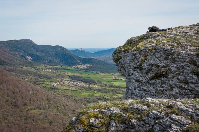 Tourist sitting on high mountain