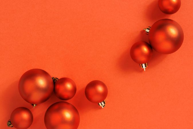 Orange holiday baubles with copy space