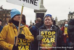 London, England, United Kingdom - March 5 2022: Two woman with “Stop Putin War Crimes” sign 43OxX4