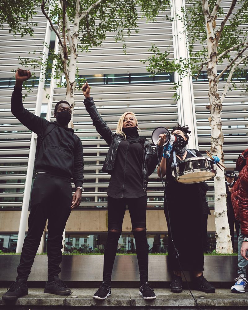 London, England, United Kingdom - June 6th, 2020: Group of people with raised fist and drum at BLM