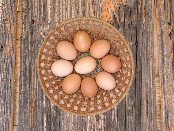 Eggs On The Wooden Background