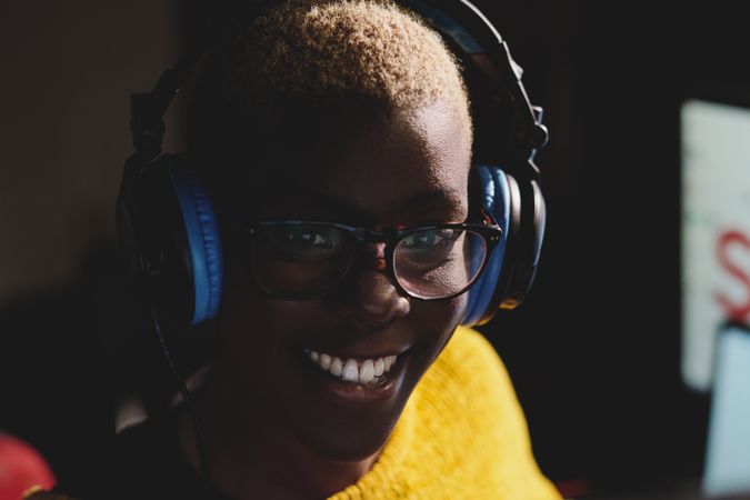 Smiling Black woman in headset