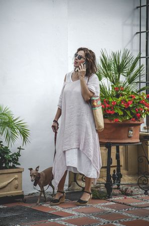 Woman walking with dog on the street