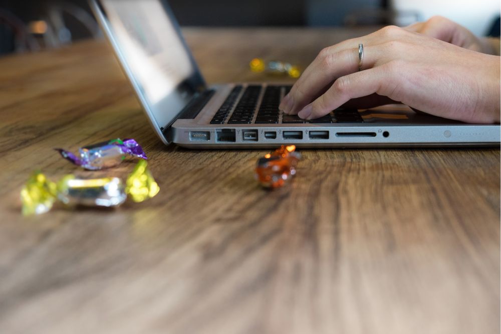 Side view of laptop with candy