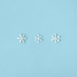 Row of snowflakes on blue background