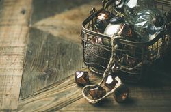 Christmas tree decorations in wire box, close up, copy space