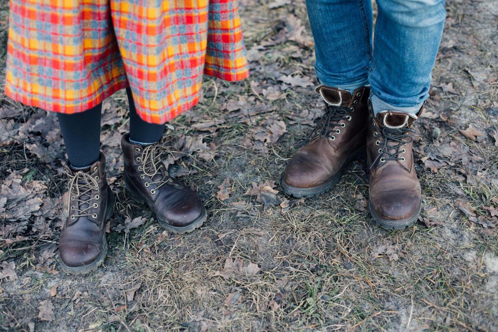 Two people wearing leather boots