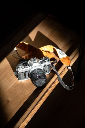 Vintage camera on wooden counter