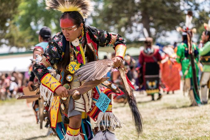 Red Wing, MN, USA - July 8th, 2017: Native American man dancing with feathers at Pow Wow