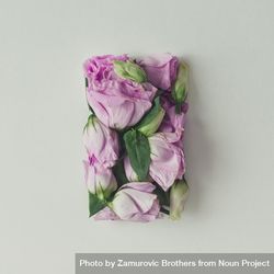 Pink flowers in shape of a gift box on light  background bEW1n5