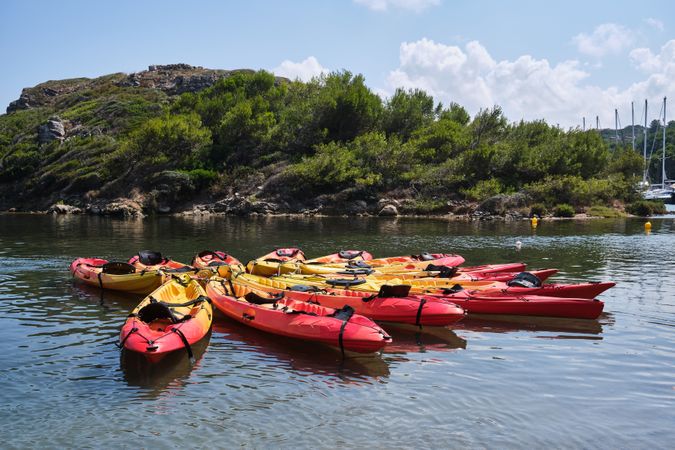 Colorful kayaks on rippling sea