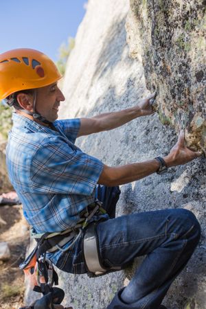 Free climber climbing in nature