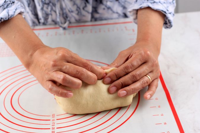 Female Hand Shaping Molding Bread