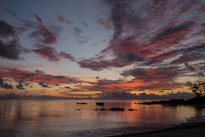 Beach in Mauritius with orange and purple sky