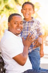 Portrait of Son and Father Outdoors Together.