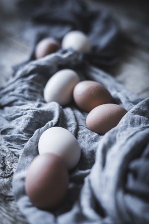 Raw eggs on tablecloth