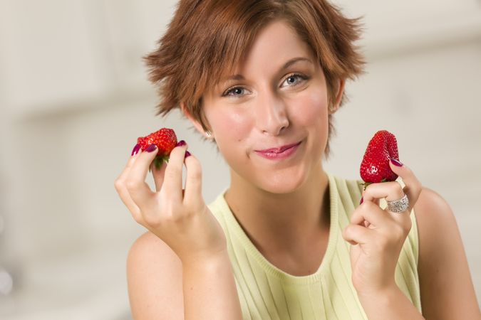 Red Haired Woman Eating Strawberry