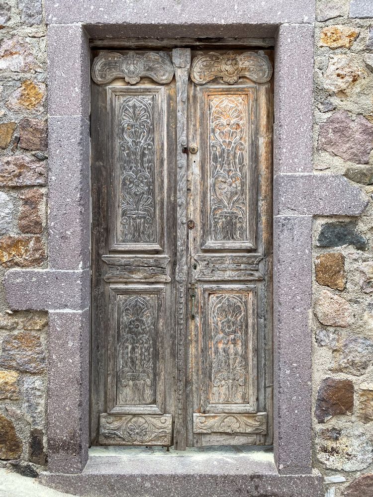 Patmian door with etched and carved decoractive mouldings